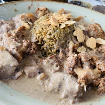DishDash - Zahra, lamb with grilled cauliflower in a yogurt sauce over freekeh (wheat grain), topped with toasted almonds. - Middle Eastern Near Me - Sunnyvale, California DishDash - Zahra, lamb with grilled cauliflower in a yogurt sauce over freekeh (wheat grain), topped with toasted almonds. - Middle Eastern Near Me - Sunnyvale, California