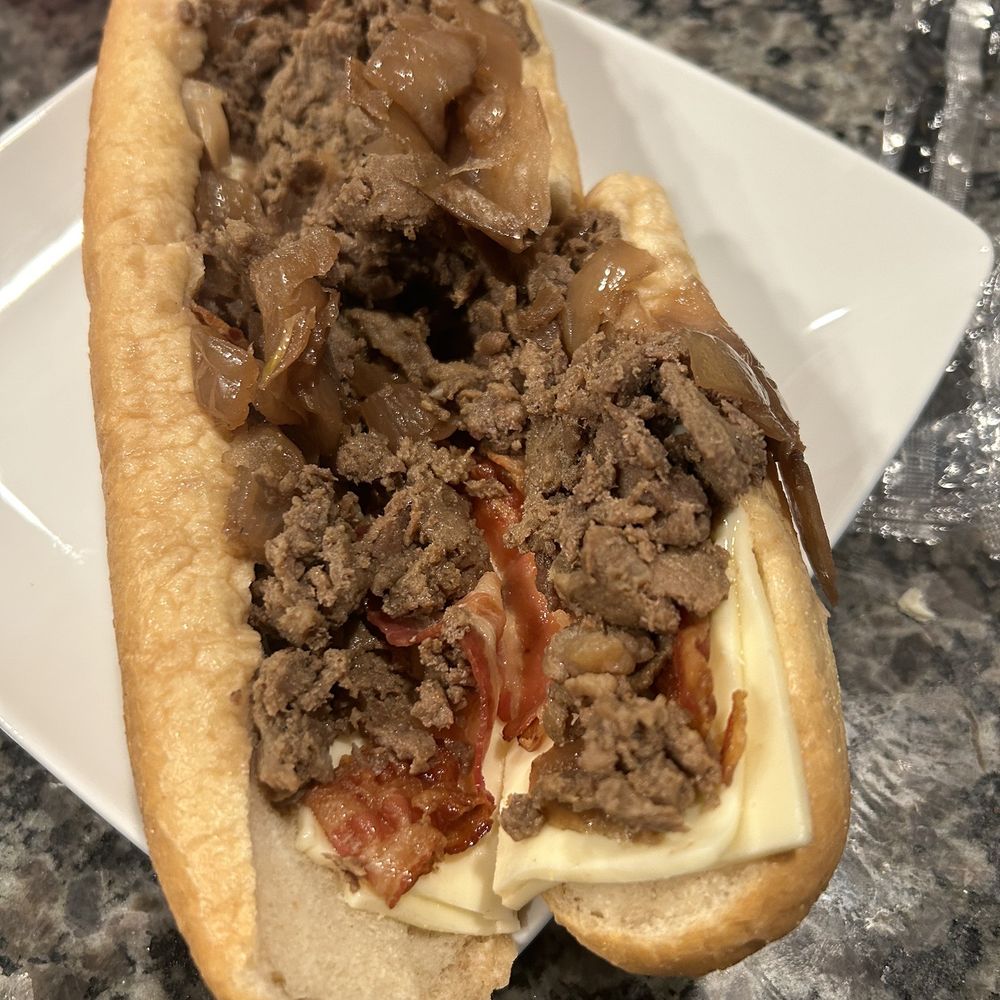 Was supposed to be a cheesesteak w/ extra American, bacon and caramelized onions. Was supposed to be a cheesesteak w/ extra American, bacon and caramelized onions.
