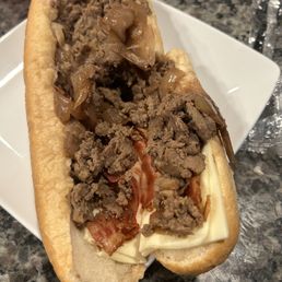 Was supposed to be a cheesesteak w/ extra American, bacon and caramelized onions. Was supposed to be a cheesesteak w/ extra American, bacon and caramelized onions.