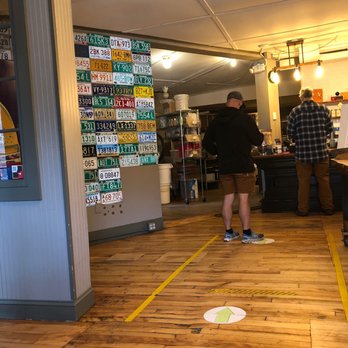 Nest Coffee & Bakery - a man standing in a coffee shop - Coffee & Tea Near Me - Essex Junction, Vermont