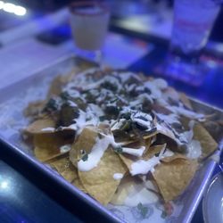 Banditos Bar & Kitchen White Marsh - DITO'S NACHOS. They were loaded with queso, salsa, black beans, jalapeños, pico, and a delicious cream.