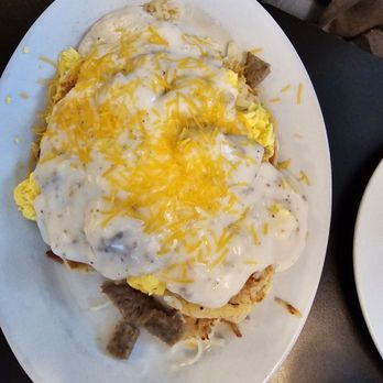 Chris' Cafe - Biscuits and gravy with hashbrowns and sauage all covered. - Cafes Near Me - Clearfield, Utah