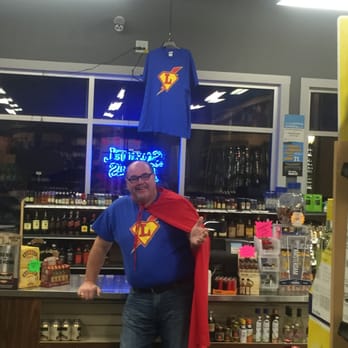 One Stop Liquor - a man wearing a superman cape - Beer, Wine & Spirits Near Me - Millis, Massachusetts