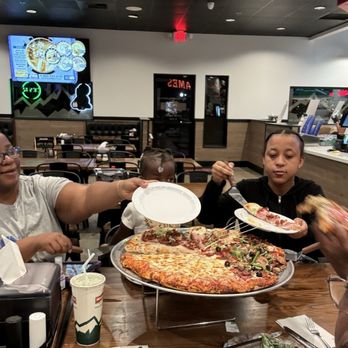 Mountain Mike's Pizza - This is what I love about Mountain Mike's...splitting the pizza to satisfy the entire family. This is the Everest and half cheese pizza - Pizza Near Me - Sparks, Nevada