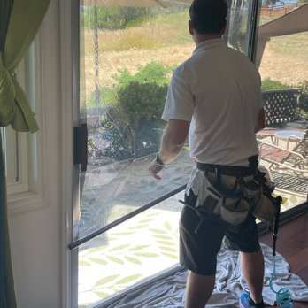 Advanced Solar Technologies - Placing the tint on the window - Home Window Tinting Near Me - San Diego, California