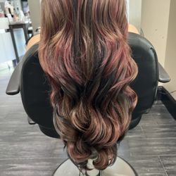 Erin Milan Salon & Spa - Red and black balayage on long layers.