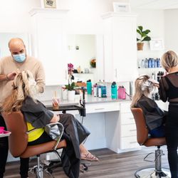 Localluv Salon - Our owner Meghan working side by side by her co-worker Jamal