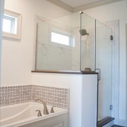 Shane McLendon Builder - Separate walk-in shower and tub from one of our newly built homes. Learn more at shanethehomebuilder.com.
