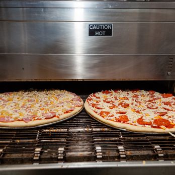 Pizza Edge - two uncooked pizzas on a grill - Pizza Near Me - Burnside, Arizona Pizza Edge - two uncooked pizzas on a grill - Pizza Near Me - Burnside, Arizona