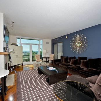 Best Choice Painting Improvements - Before: Living room w/ dark navy paint. Downtown San Diego Condo review by Jillian - Painters Near Me - Napa, California