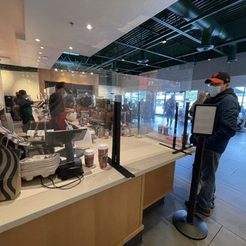 Starbucks - Pick up counter and main entrance in the background. - Coffee & Tea Near Me - San Bruno, California
