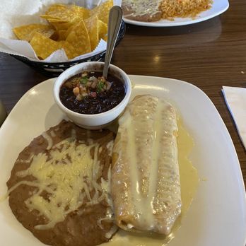 Chapala Mexican Grill - vegetarian chimichanga with refried beans and black beans as sides (front) and chicken taquitos (back) - Mexican Near Me - Worthington, Ohio