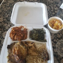 Smothered chicken , greens, mac n cheese and yams