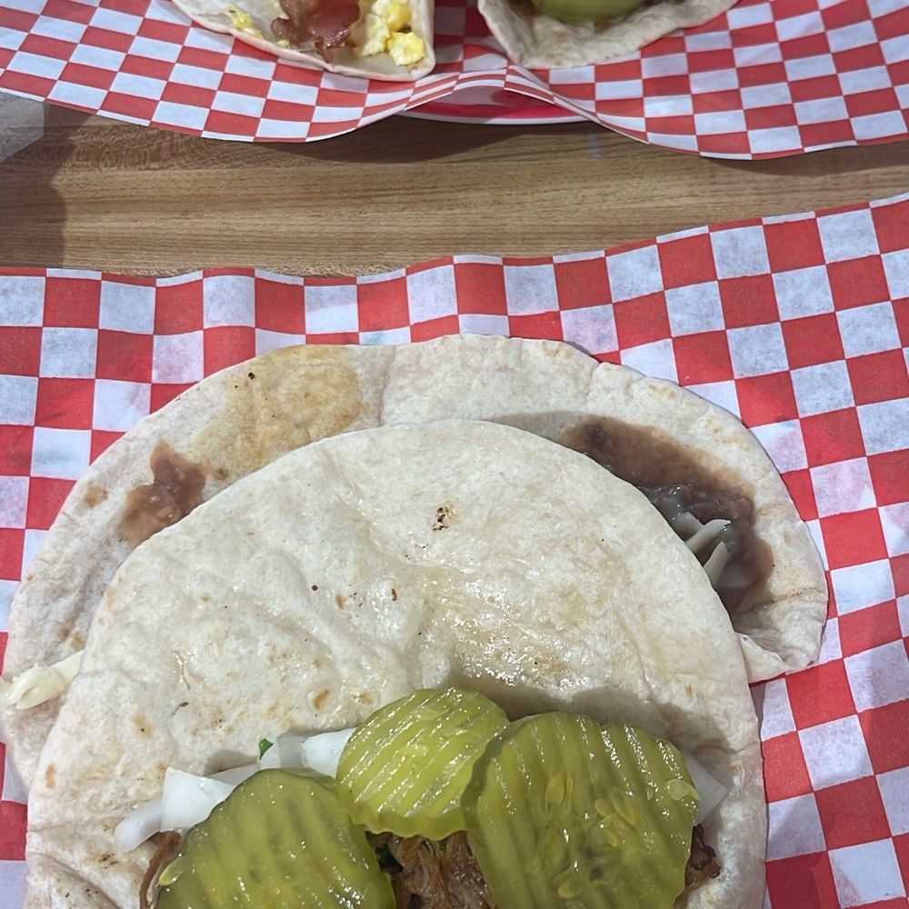 Brisket taco, bean and cheese, bacon and egg Brisket taco, bean and cheese, bacon and egg