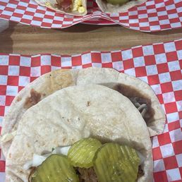 Brisket taco, bean and cheese, bacon and egg Brisket taco, bean and cheese, bacon and egg