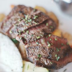 Bloom Restaurant + Bar - Prime 5 oz. Flat Iron Steak & Eggs. Beautifully seared steak, paired with fried eggs, fingerling potatoes, and heirloom vegetables.
