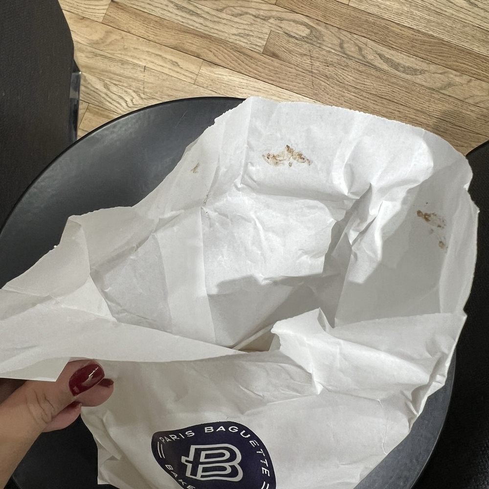 Cashier left her chocolate finger print to the opening of my bag. Cashier left her chocolate finger print to the opening of my bag.