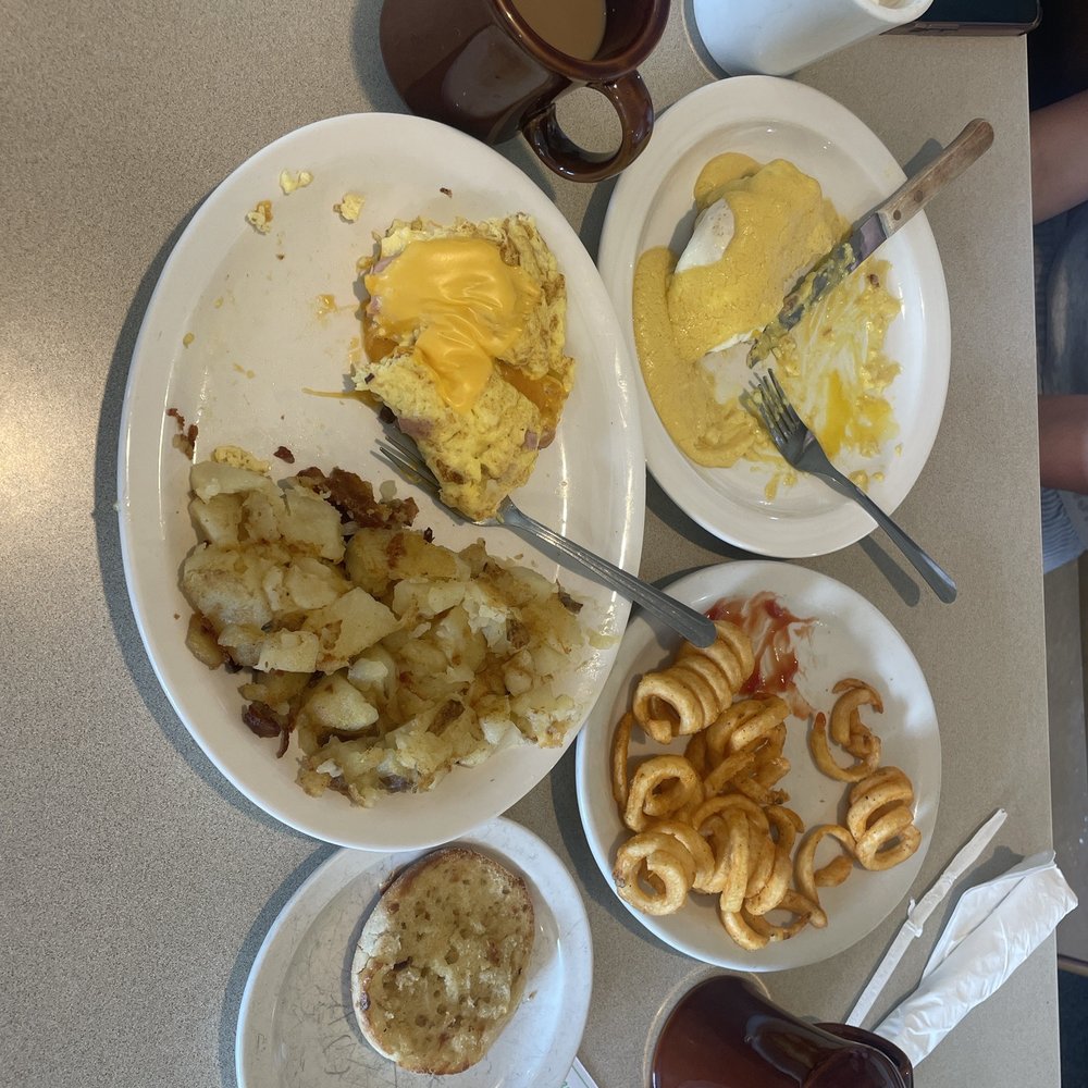 I had the ham and cheese omelette with potatoes and an english muffin. She had the eggs benedict with curly fries.
