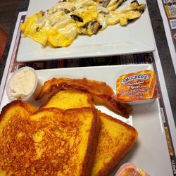 2, 2, 2 eggs, bacon & choice of French toast or pancakes.  My husband added mushrooms and cheese to his eggs & picked scrambled