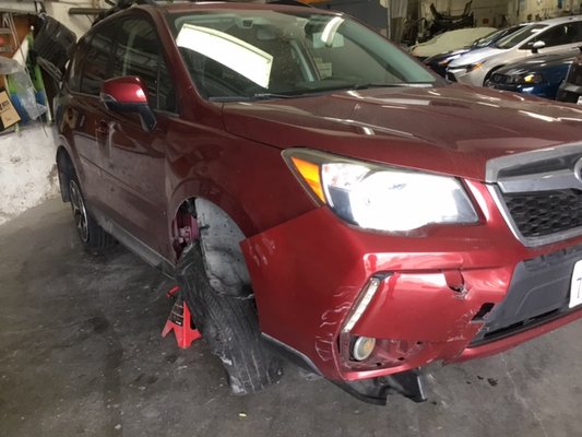 '14 Subaru Forester Repair - Customer brought car in thinking car was a total loss and was not possible to be repaired to pre-existing condition. Less than a month later, car was released with front suspension replaced, new set of wheels, tires, front bumper replaced and fresh paint job. Car runs smoothly. '14 Subaru Forester Repair - Customer brought car in thinking car was a total loss and was not possible to be repaired to pre-existing condition. Less than a month later, car was released with front suspension replaced, new set of wheels, tires, front bumper replaced and fresh paint job. Car runs smoothly.