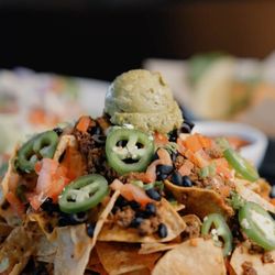 Craggy Range Sports Bar & Grill - Piled-high nachos with seasoned beef, black beans, jalapeños, and guac--always a Craggy crowd favorite.