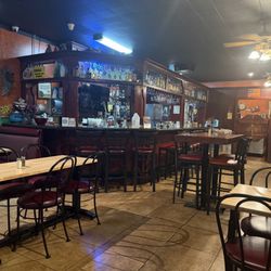 Ocampo's Restaurant - Dining area showing bar with seating.