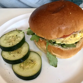 3 Little Figs - Egg & Feta-scrambles egg, Feta, greek herbs, tomato, arugula on a brioche roll - Coffee & Tea Near Me - Somerville, Massachusetts
