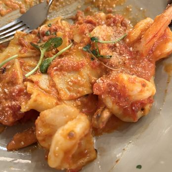 La Piazza - Paepadel and vodka sauce with shrimp. Absolutely delicious! - A plate of pasta with shrimp, coated in tomato sauce, garnished with microgreens, and served in a restaurant. The dish appears freshly prepared with visible pasta, shrimp, and sauce, presented on a ceramic plate. - Pizza Near Me - Allentown, New Jersey