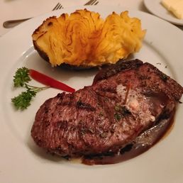 14 oz aged NY strip (medium) and twice baked potato.