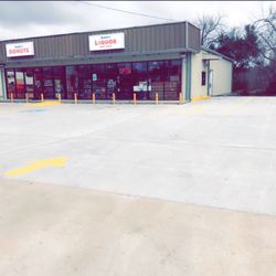 Sam Liquor - Along with drive-thru for daily convenience after work and morning breakfast from the  Do-Nuts next door.