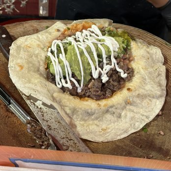 La Parrilla Loca - Burrito in the making - Food Stands Near Me - Oakland, California La Parrilla Loca - Burrito in the making - Food Stands Near Me - Oakland, California
