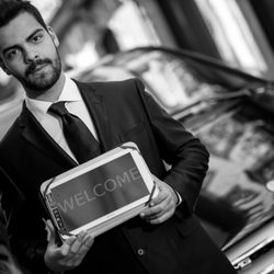 Taxi Reservation Paris - Waiting Airport with panel on behalf of the customer