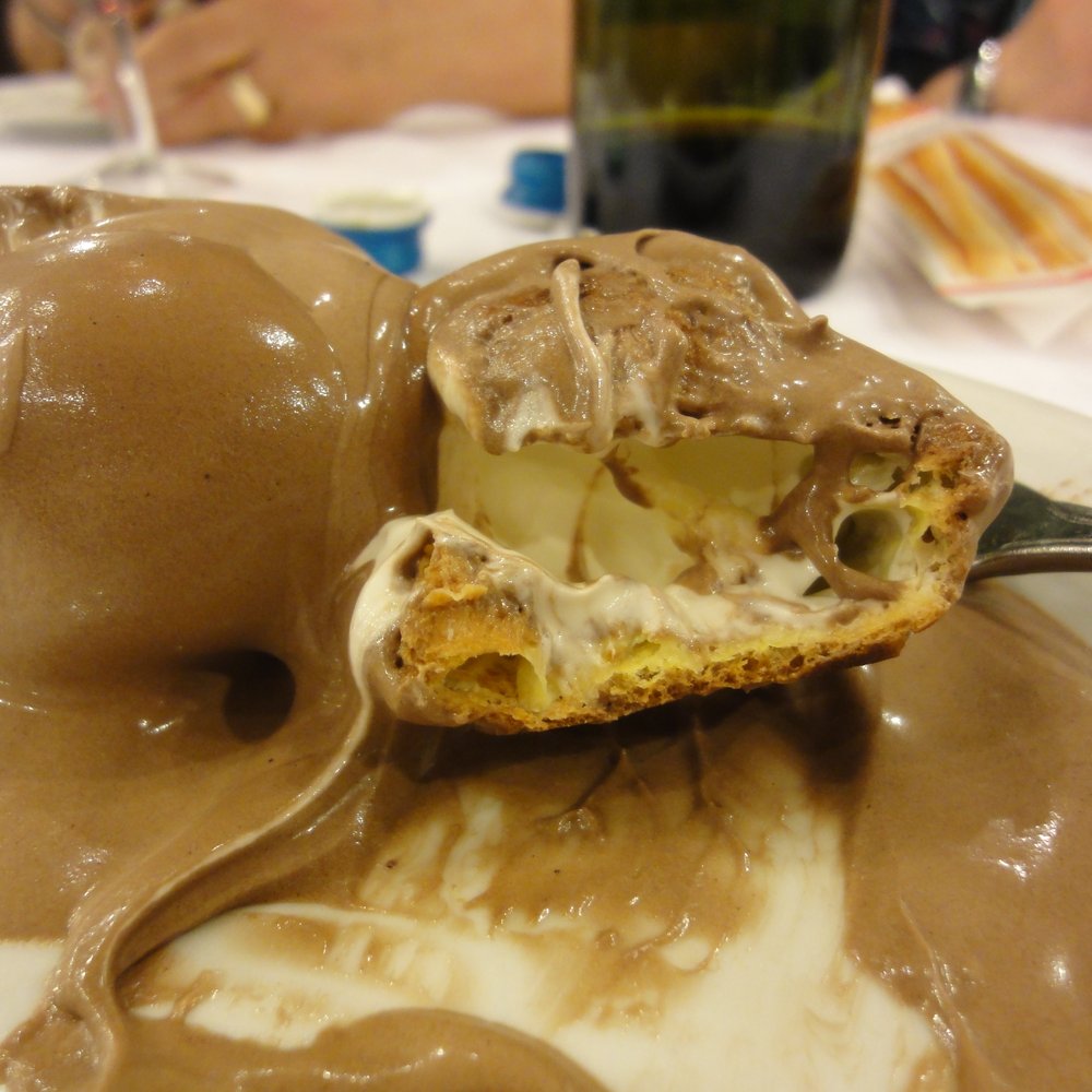 Calafuria Unione - Profiterole (cream filled, covered in chocolate) - Italian Near Me - Milan, Michigan Calafuria Unione - Profiterole (cream filled, covered in chocolate) - Italian Near Me - Milan, Michigan