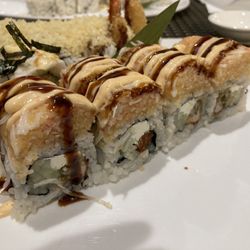 Taku Japanese Steakhouse - Oyster Roll: Crispy Fried Oyster with Cream Cheese, and Cucumber on the inside. Topped with Lobster on the outside.