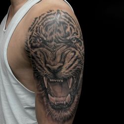 Legendary Tattoos - Black and grey tiger tattoo by Legendary Artist David Blank