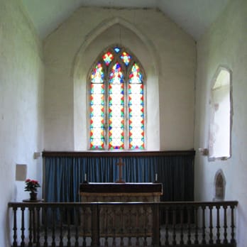 St Botolph's Church, Botolphs - Sanctuary and East window. The piscina (right) and aumbry (left) in the walls date from the 13th century, c. 1250. - Churches Near Me - Steyning, WSX