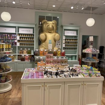 Lolli and Pops - a display of lolli pops in a store - Candy Stores Near Me Lolli and Pops - a display of lolli pops in a store - Candy Stores Near Me