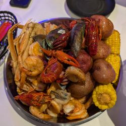 Seafood bucket with an extra serving of potatoes. This included crab, crawfish, mussels, shrimp, corn, potato, sausage!