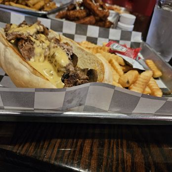 Lucky Bastard Saloon - The Lucky Philly with Mushrooms & Fries - Sports Bars Near Me - Nashville, Tennessee