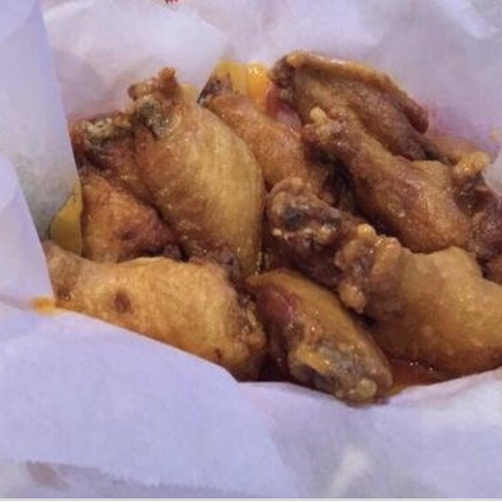 Traditional bone-in wings, covered in tweener buffalo sauce. Traditional bone-in wings, covered in tweener buffalo sauce.