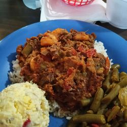 Smothered shrimp over rice, seasoned green beans and potato salad. $15