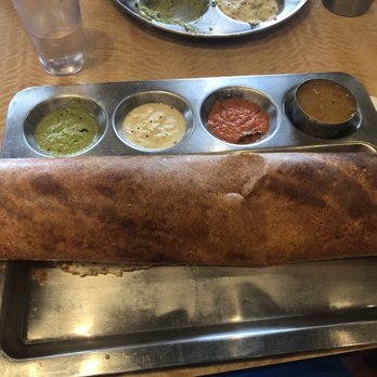 Saravana Bhavan - Mysore Masala Dosa (Red Chilli Chutney spread on a thin Rice and Lentil Crepe filled with Mashed Potatoes and Onions) ($10.50) - Indian Near Me - Edison, New Jersey