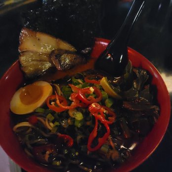 Black Dynasty Ramen - Hellfire Ramen bowl. Rice lager in the background. - Ramen Near Me - Nashville, Tennessee Black Dynasty Ramen - Hellfire Ramen bowl. Rice lager in the background. - Ramen Near Me - Nashville, Tennessee