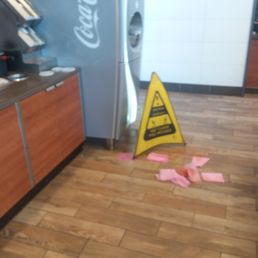 Mess directly in front of the soft drink fountain.  They didn't even bother to clean it up, just put the sign out and create a slip hazard.