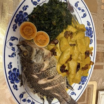 Safari Njema Restaurant - Broiled Talapia, green bananas in Tumeric curry, stewed greens, homemade hot sauce. - African Near Me - Seattle, Washington Safari Njema Restaurant - Broiled Talapia, green bananas in Tumeric curry, stewed greens, homemade hot sauce. - African Near Me - Seattle, Washington