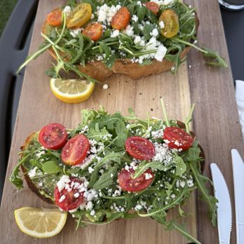 Arvo Café - loaded avocado toast - arugula, local cherry tomatoes & feta - Cafes Near Me - Honolulu, Hawaii
