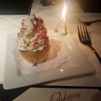 Parkway Grill - Our complimentary celebration cupcake =) - New American Near Me - Pasadena, California Parkway Grill - Our complimentary celebration cupcake =) - New American Near Me - Pasadena, California