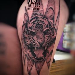 Gold Cobra Tattoo - Tiger in skin tear. Done by Steven Alfieri