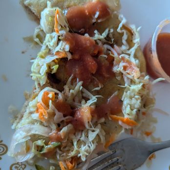 Adelita's Antojitos - Revueltas pupusa, loaded with curtido and savory salsa - Salvadoran Near Me - San Francisco, California