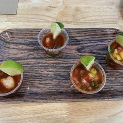 The Oyster Shuckers Oyster Bar & Taqueria - Oyster shooters!  The special one with mango was delicious, but I am a simple man and preferred the original!